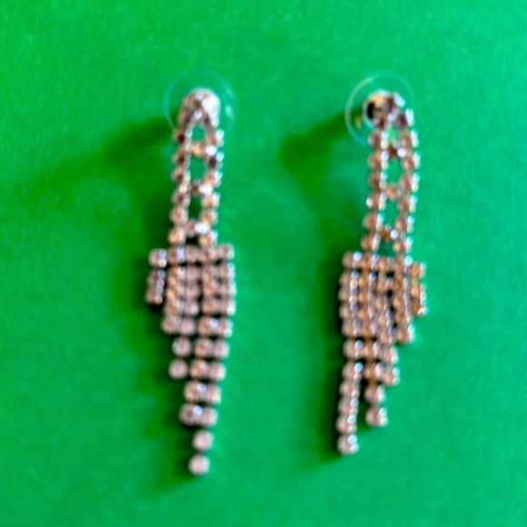 Jewelry - Glamorous 2 1/2” silver-tone rhinestone earrings with protective earring backs.
